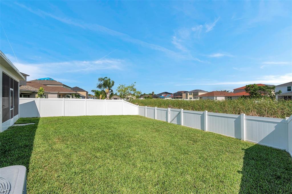 7523 Tangle Brook Boulevard Gibsonton, FL 33534 - Photo 32 of 35 a view of a backyard with plants and lake view