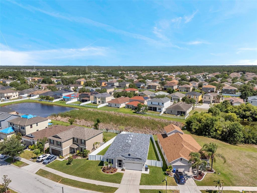 7523 Tangle Brook Boulevard Gibsonton, FL 33534 - Photo 34 of 35 an aerial view of residential houses with outdoor space and lake view