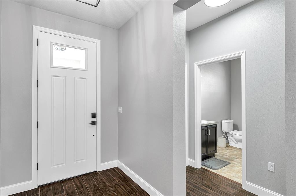 7523 Tangle Brook Boulevard Gibsonton, FL 33534 - Photo 5 of 35 a view of a bathroom from a hallway