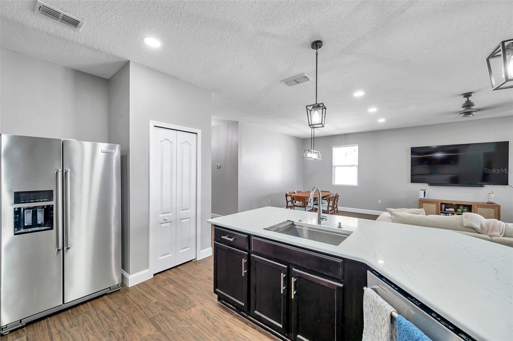 7523 Tangle Brook Boulevard Gibsonton, FL 33534 - Photo 9 of 35 a kitchen with a sink and refrigerator