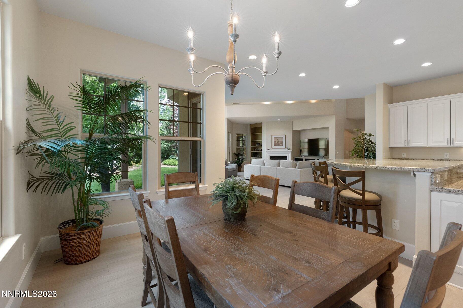 16925 Rue Du Parc Reno, NV 89511 - Photo 10 of 34 a view of a dining room with furniture and a potted plant