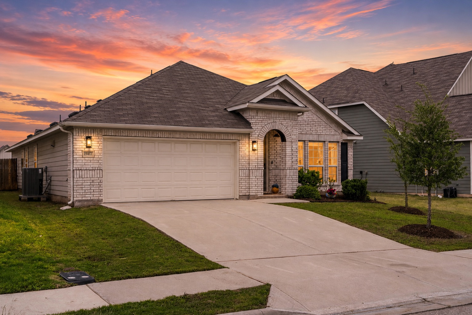 19412 Forman Drive Pflugerville, TX 78660 - Photo 1 of 34 A spacious driveway and attached two-car garage provide convenient parking and everyday functionality.