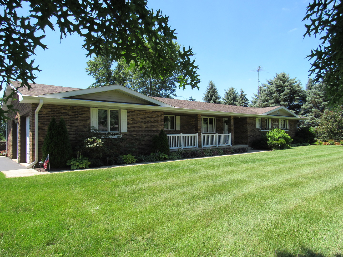 1027 West Kennedy Road Braidwood, IL 60408 - Photo 1 of 55 a front view of house with yard and green space