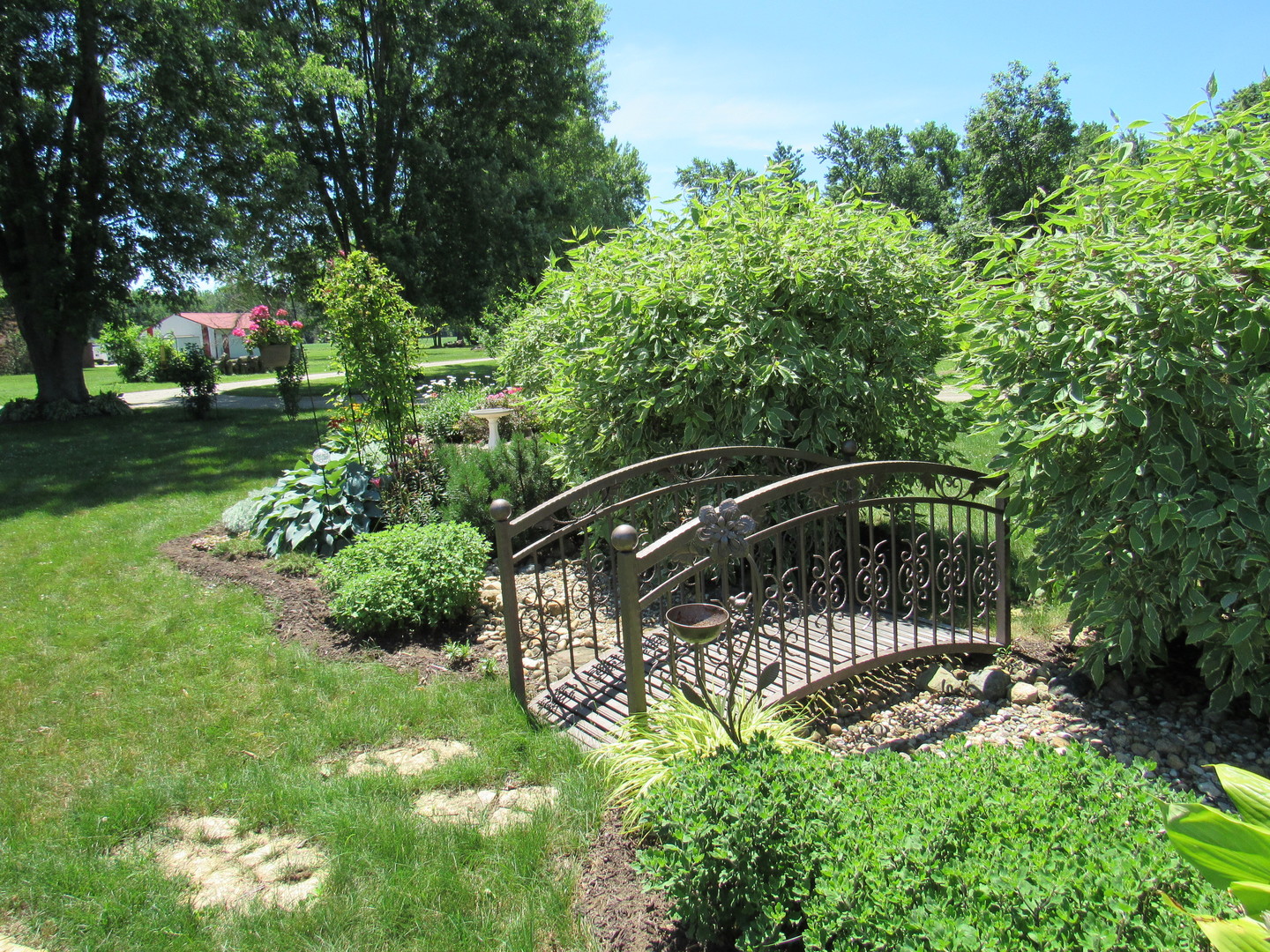 1027 West Kennedy Road Braidwood, IL 60408 - Photo 11 of 55 a view of a chair and tables in the garden