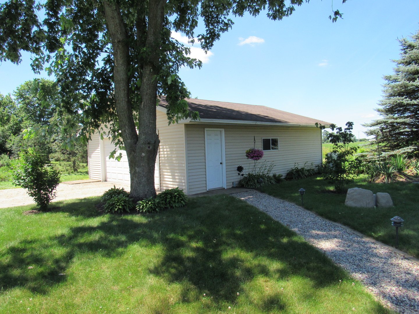 1027 West Kennedy Road Braidwood, IL 60408 - Photo 13 of 55 a view of backyard of house with green space