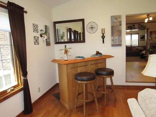 1027 West Kennedy Road Braidwood, IL 60408 - Photo 23 of 55 a dining room with furniture and wooden floor