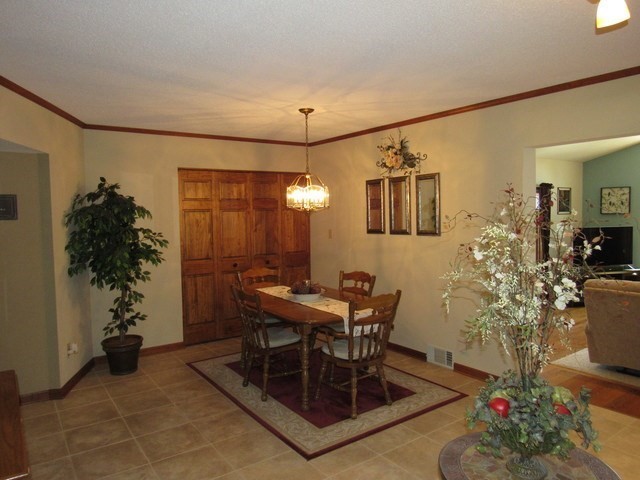 1027 West Kennedy Road Braidwood, IL 60408 - Photo 28 of 55 a view of a dining room with furniture and chandelier