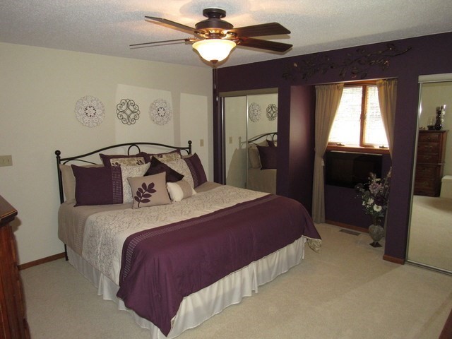 1027 West Kennedy Road Braidwood, IL 60408 - Photo 35 of 55 a bedroom with a bed and a chandelier
