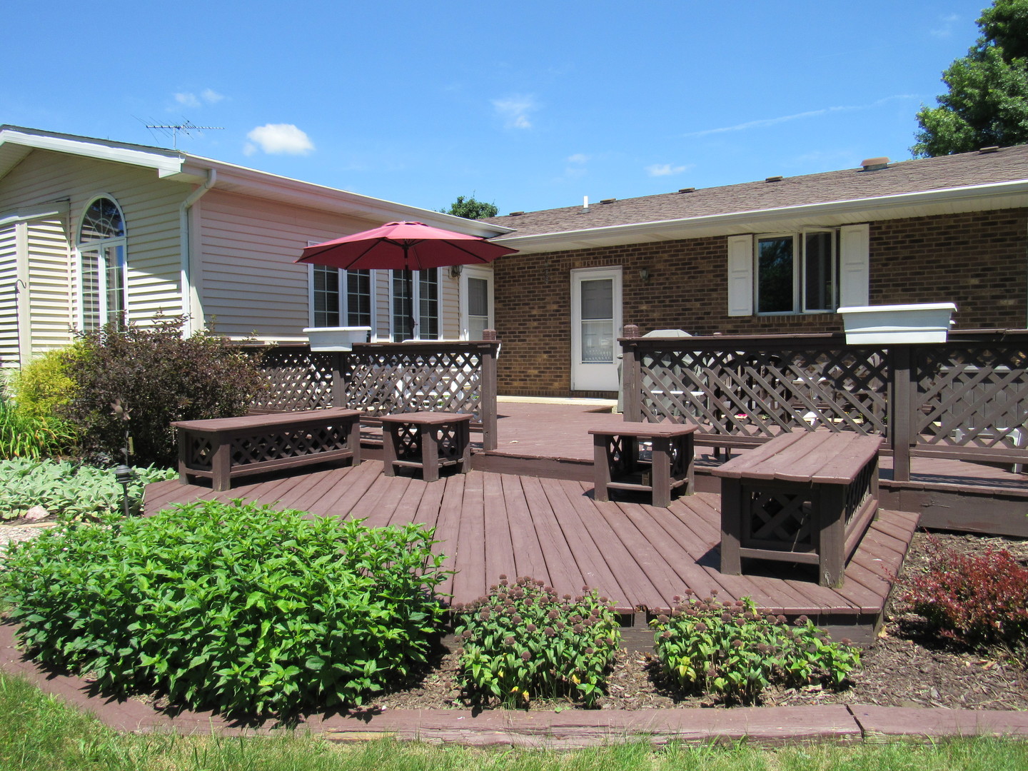 1027 West Kennedy Road Braidwood, IL 60408 - Photo 6 of 55 a view of a house with backyard and sitting area