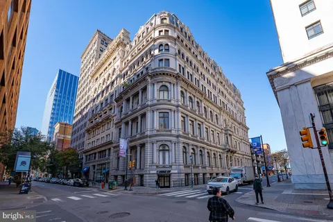 a view of a big building next to a road