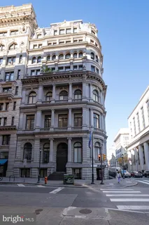 a tall building sitting on the side of a street