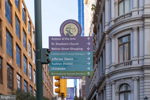 a sign on a pole on a street