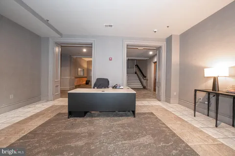 a view of living room with furniture and a table