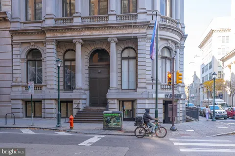 a front view of a building with glass windows