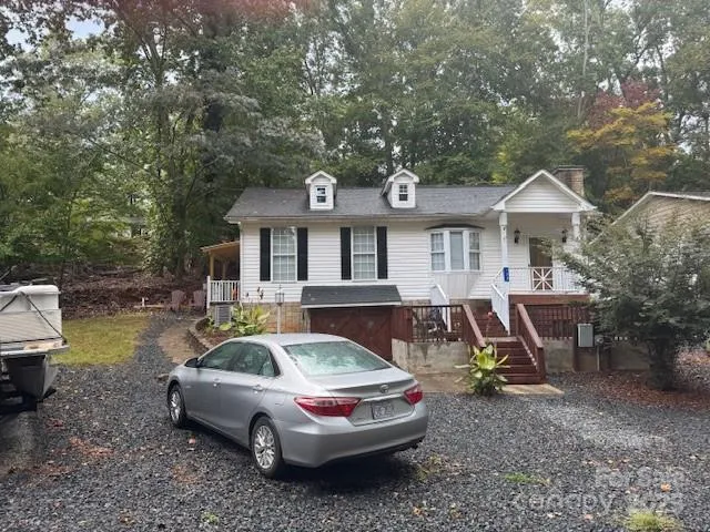a front view of a house with a garden and patio