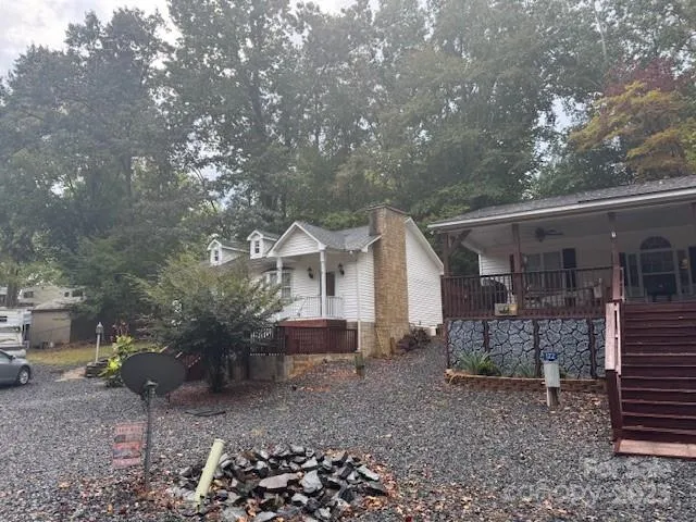 a view of a house with a backyard
