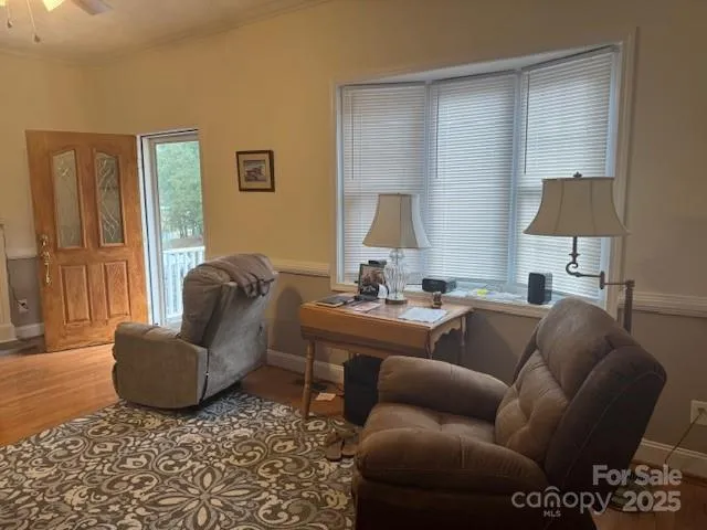 a living room with furniture and a lamp