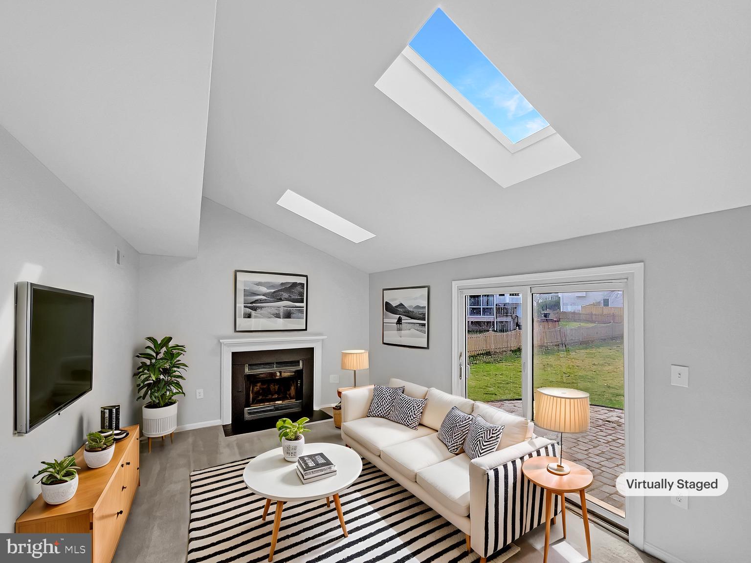 1624 Hiddenbrook Drive Herndon, VA 20170 - Photo 2 of 58 a living room with furniture a flat screen tv and a fireplace