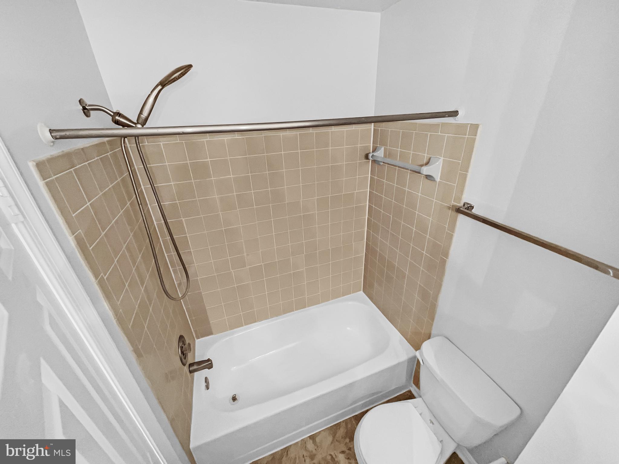 1624 Hiddenbrook Drive Herndon, VA 20170 - Photo 23 of 58 a bathroom with a toilet and a shower