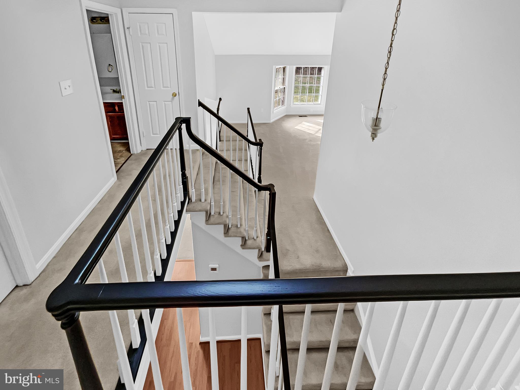 1624 Hiddenbrook Drive Herndon, VA 20170 - Photo 31 of 58 a view of staircase with railing and white walls