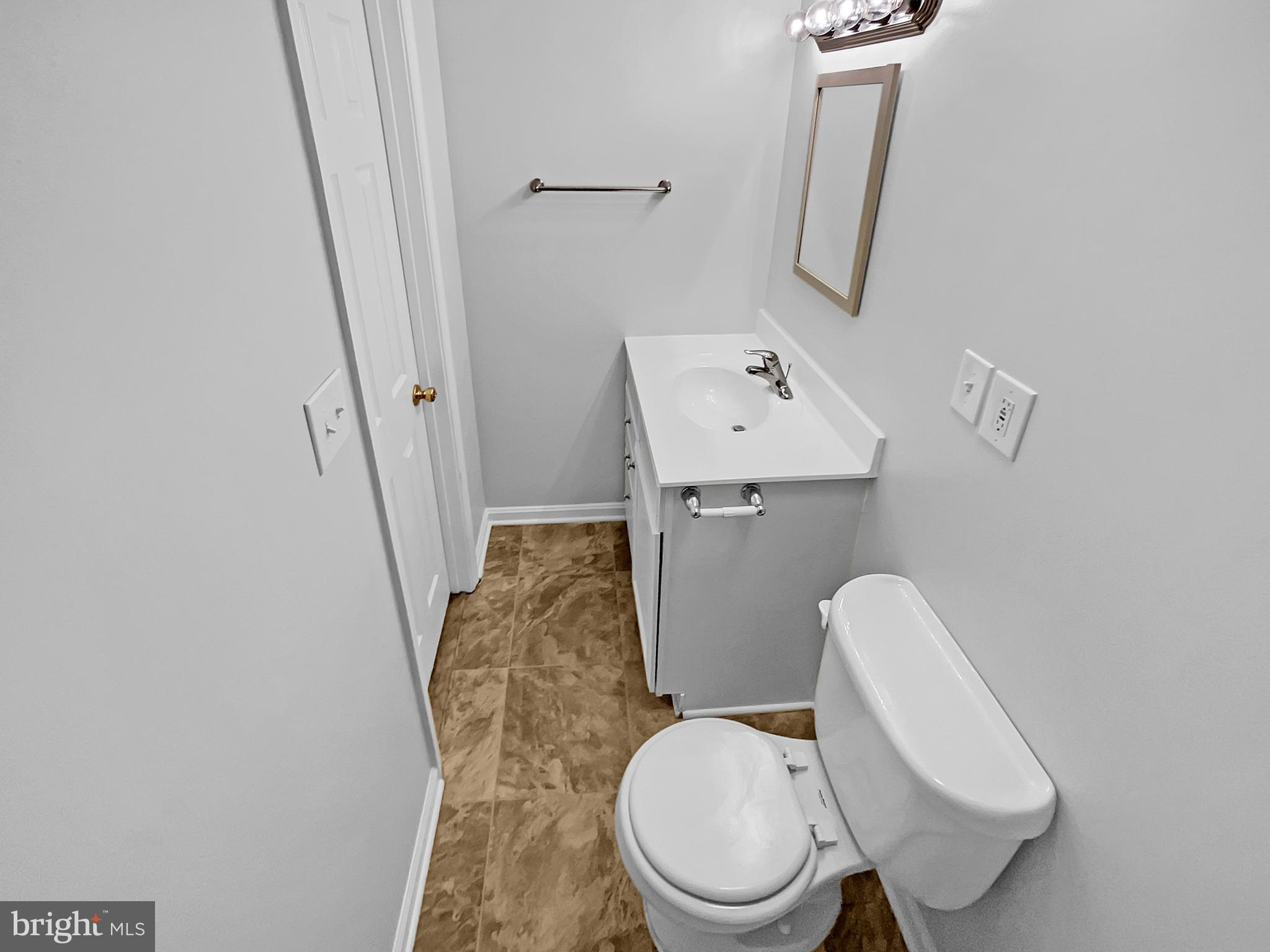 1624 Hiddenbrook Drive Herndon, VA 20170 - Photo 44 of 58 a white toilet sitting next to a sink