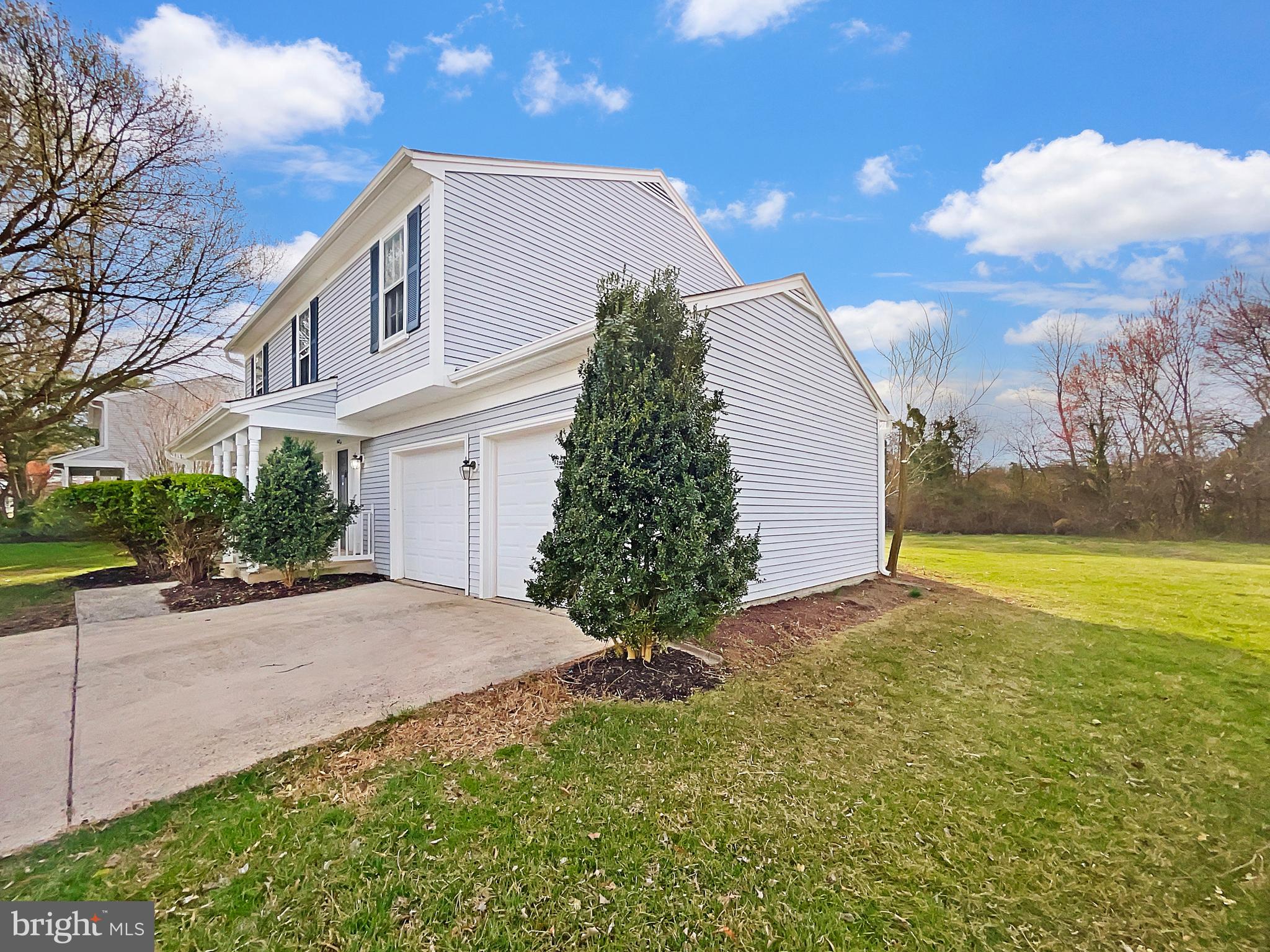 1624 Hiddenbrook Drive Herndon, VA 20170 - Photo 49 of 58 a view of a house with a yard and garage