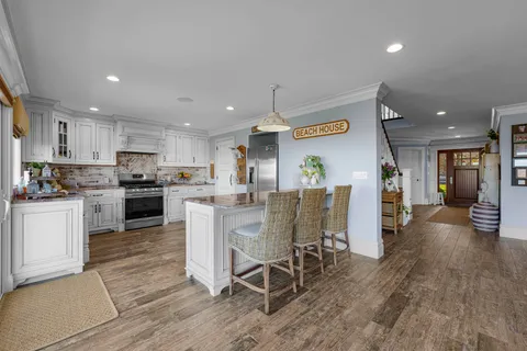a kitchen with a table and chairs in it
