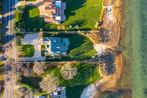 an aerial view of houses with outdoor space