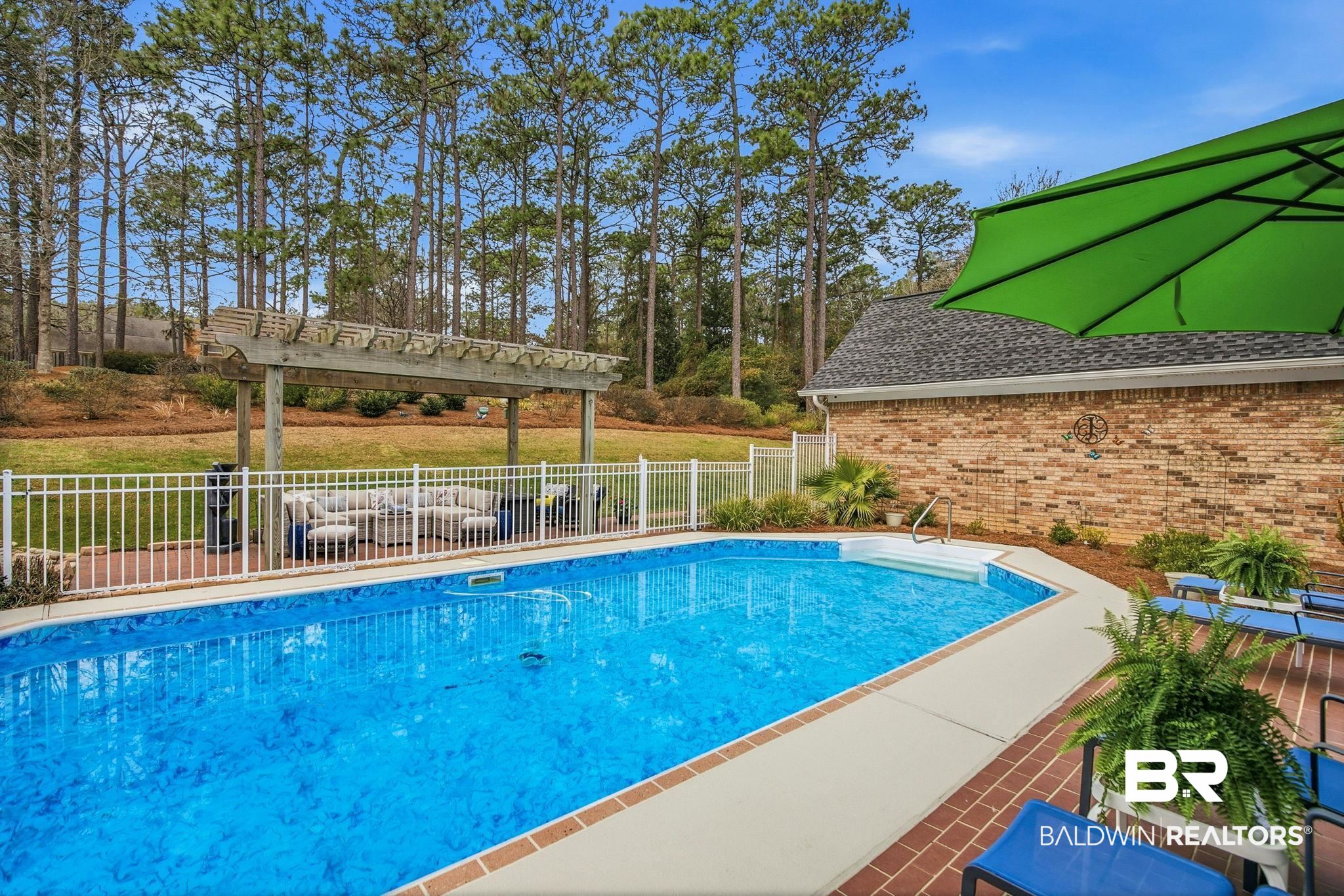 31515 Rhett Drive Spanish Fort, AL 36527 - Photo 76 of 100 32000 gallon pool. All pool furniture and equipment will convey with the home. (Liner replaced in 2023; sand filter in 2025). Pool deck was recently leveled with a 5 year warranty.