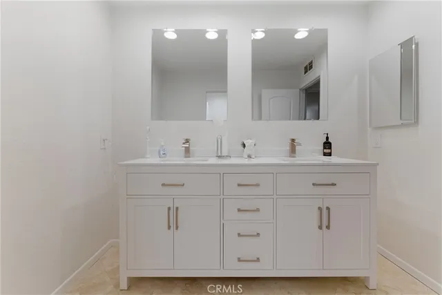 a bathroom with a sink and shower