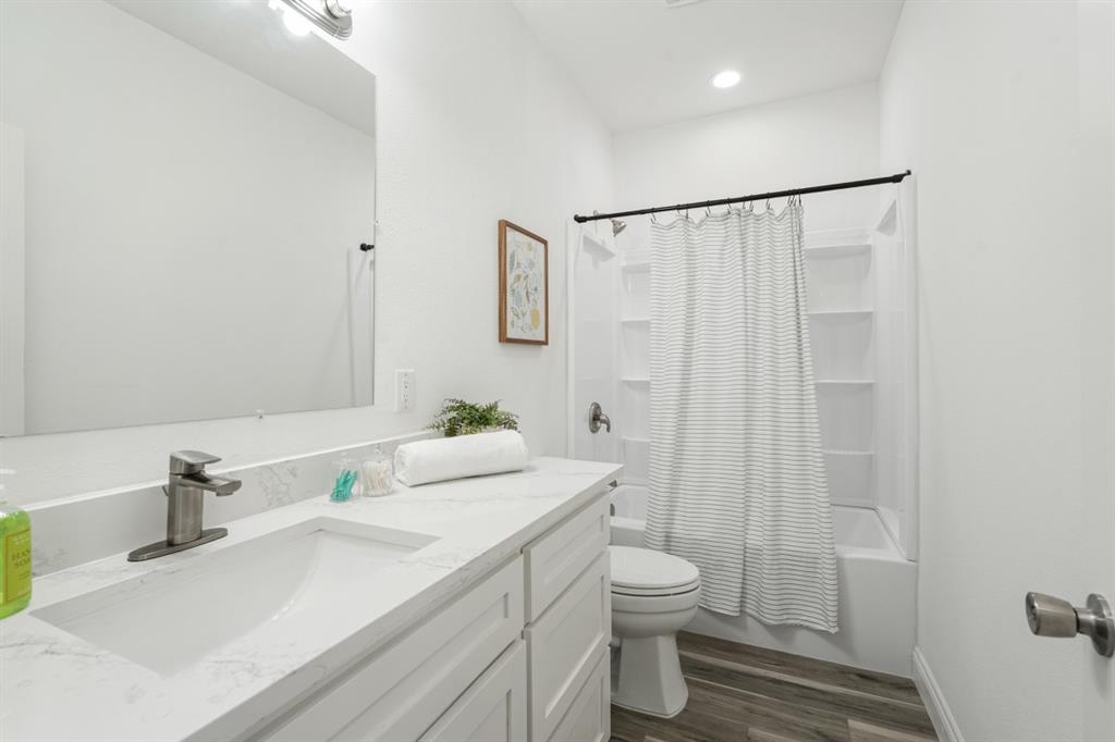 228 Windjammer Road Gun Barrel City, TX 75156 - Photo 16 of 19 a bathroom with a sink toilet and shower