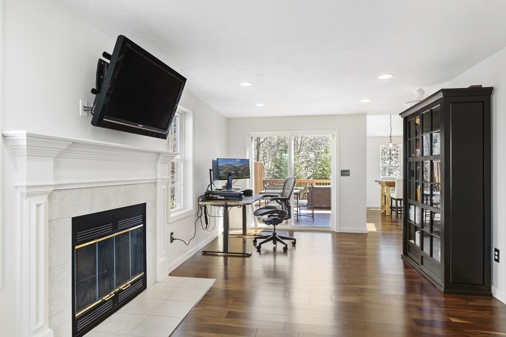 50 Sophia Drive Worcester, MA 01607 - Photo 2 of 37 a living room with furniture a fireplace and a flat screen tv