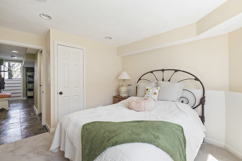 50 Sophia Drive Worcester, MA 01607 - Photo 21 of 37 a bedroom with a bed and a mirror