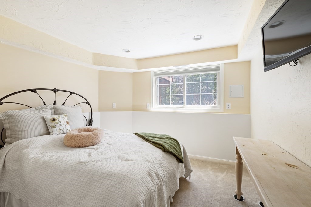 50 Sophia Drive Worcester, MA 01607 - Photo 22 of 37 a bedroom with a bed and a flat screen tv