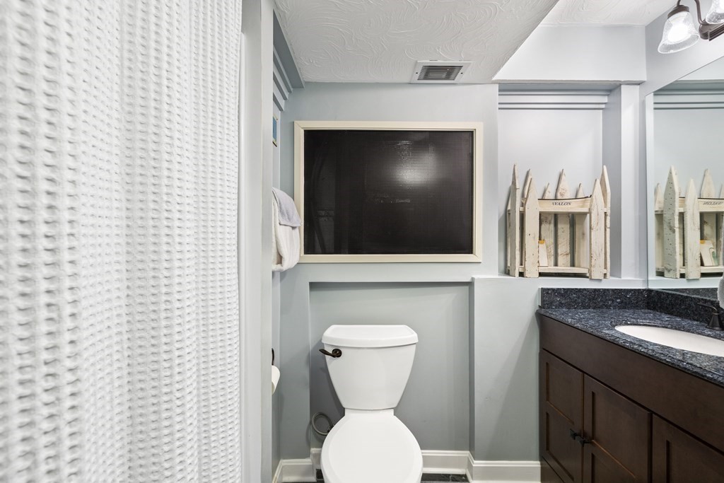 50 Sophia Drive Worcester, MA 01607 - Photo 23 of 37 a bathroom with a toilet a sink and a mirror