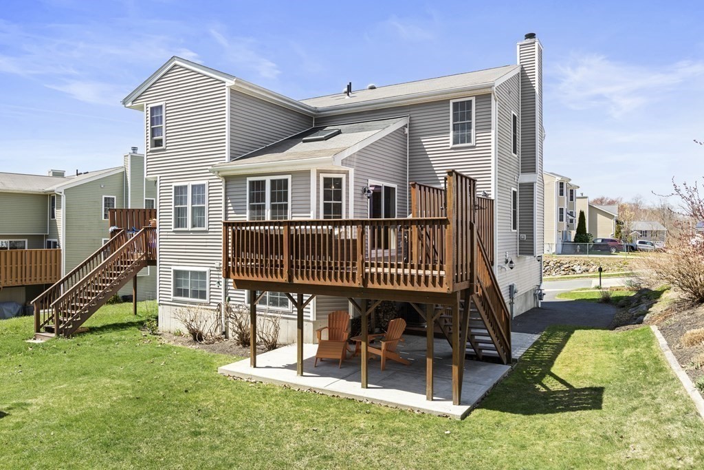 50 Sophia Drive Worcester, MA 01607 - Photo 25 of 37 a view of a house with a yard deck and furniture