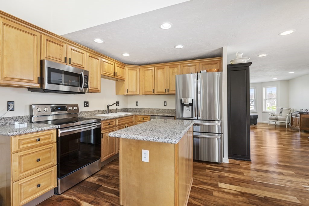 50 Sophia Drive Worcester, MA 01607 - Photo 4 of 37 a kitchen with stainless steel appliances granite countertop a refrigerator stove microwave and sink