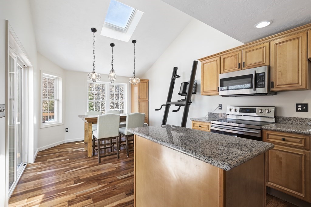 50 Sophia Drive Worcester, MA 01607 - Photo 9 of 37 a kitchen with microwave a stove and furniture