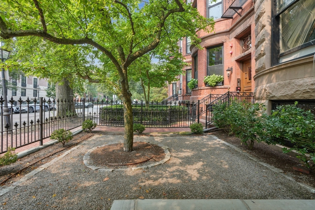 a view of a street with brick walls