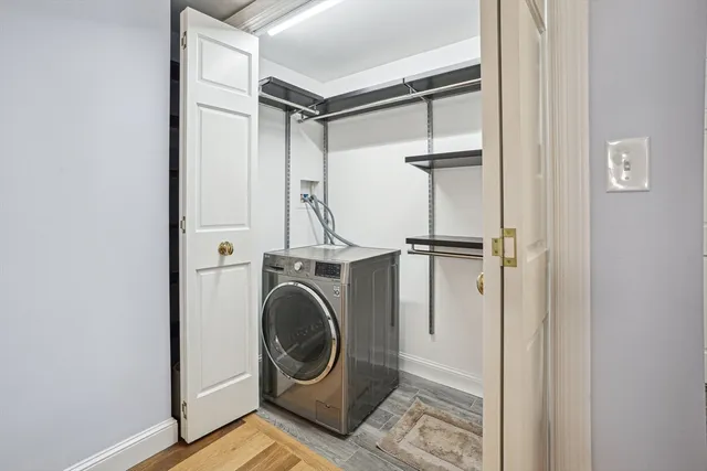 a view of a storage & utility room with washer and dryer