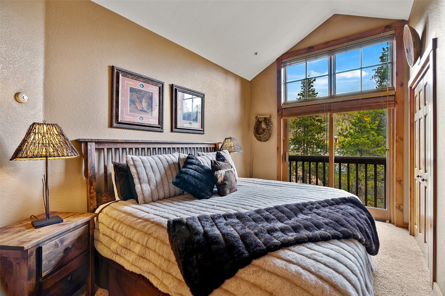 57 Lake Ridge Circle, Unit 1848 Keystone, CO 80435 - Photo 17 of 49 a bedroom with a bed a painting and a window
