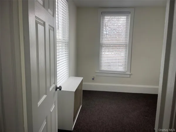 a view of a room that has a window in it