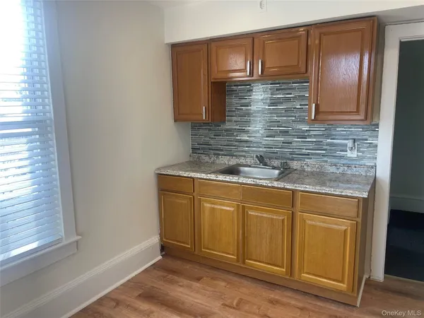 a bathroom with granite countertop cabinets and a sink