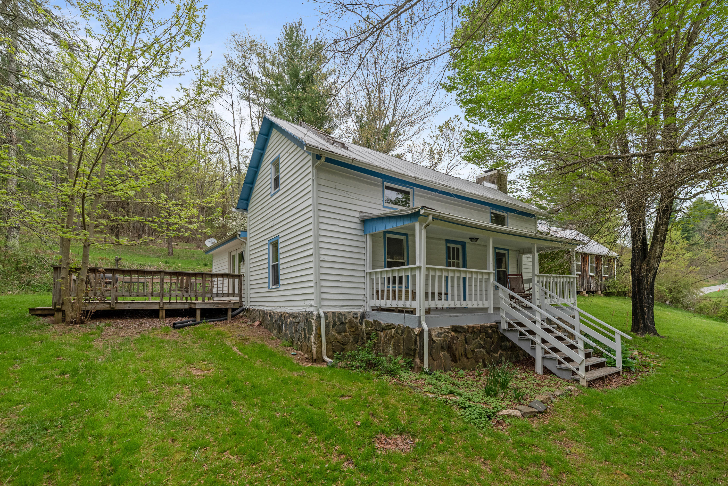 757 Halls Store Road Southwest Willis, VA 24380 - Photo 1 of 43 a view of a house with a yard