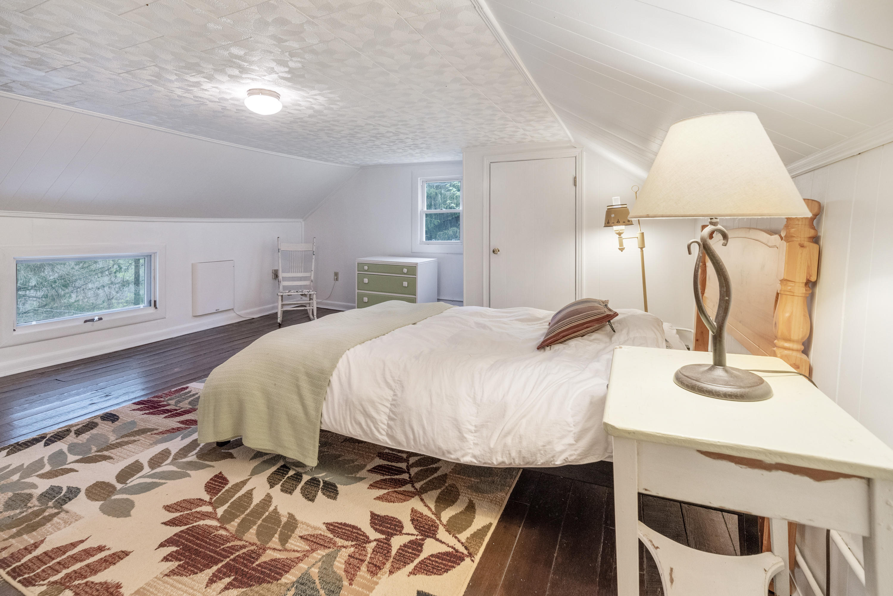 757 Halls Store Road Southwest Willis, VA 24380 - Photo 20 of 43 a bedroom with a bed and wooden floor