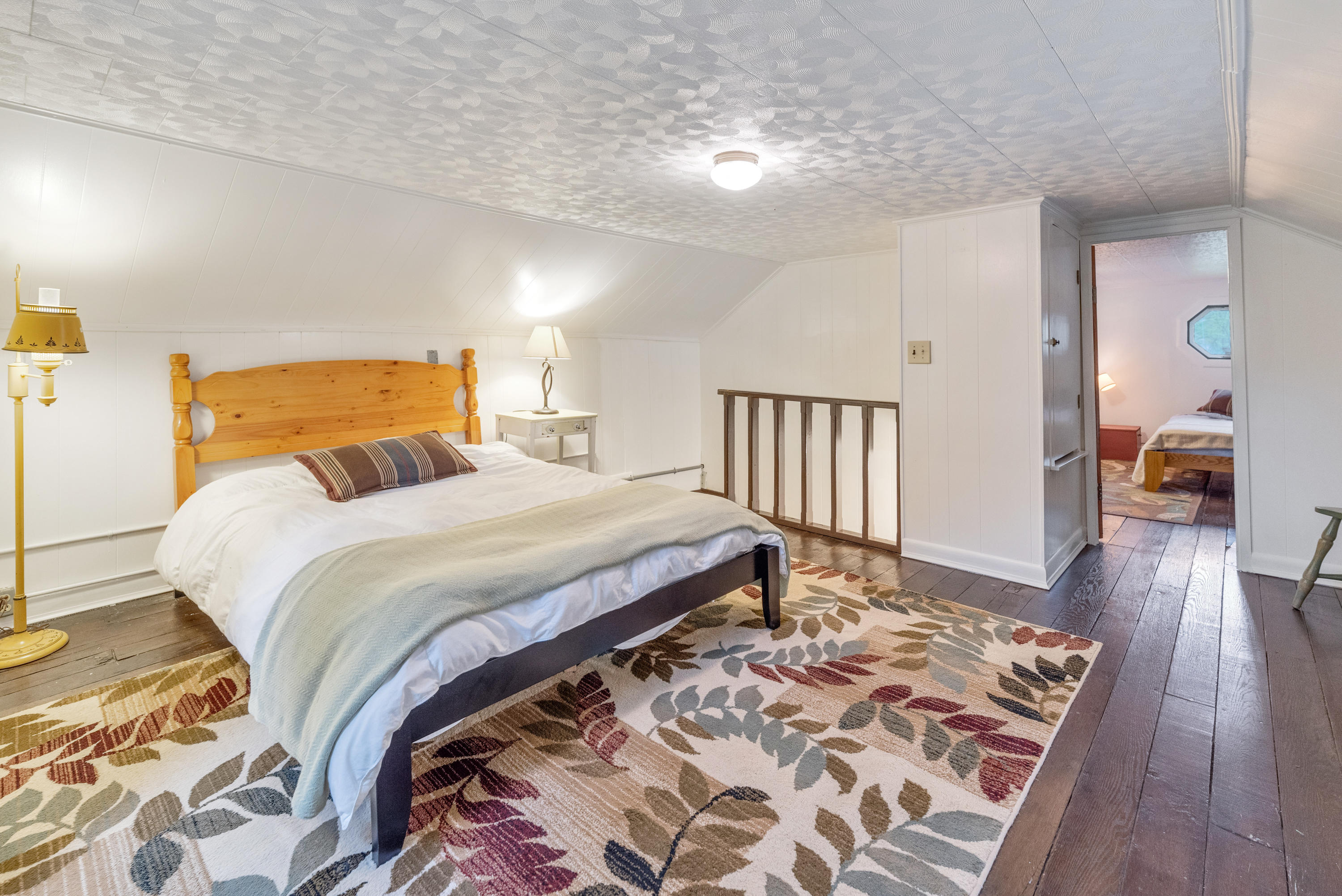 757 Halls Store Road Southwest Willis, VA 24380 - Photo 21 of 43 a bedroom with a bed and wooden floor