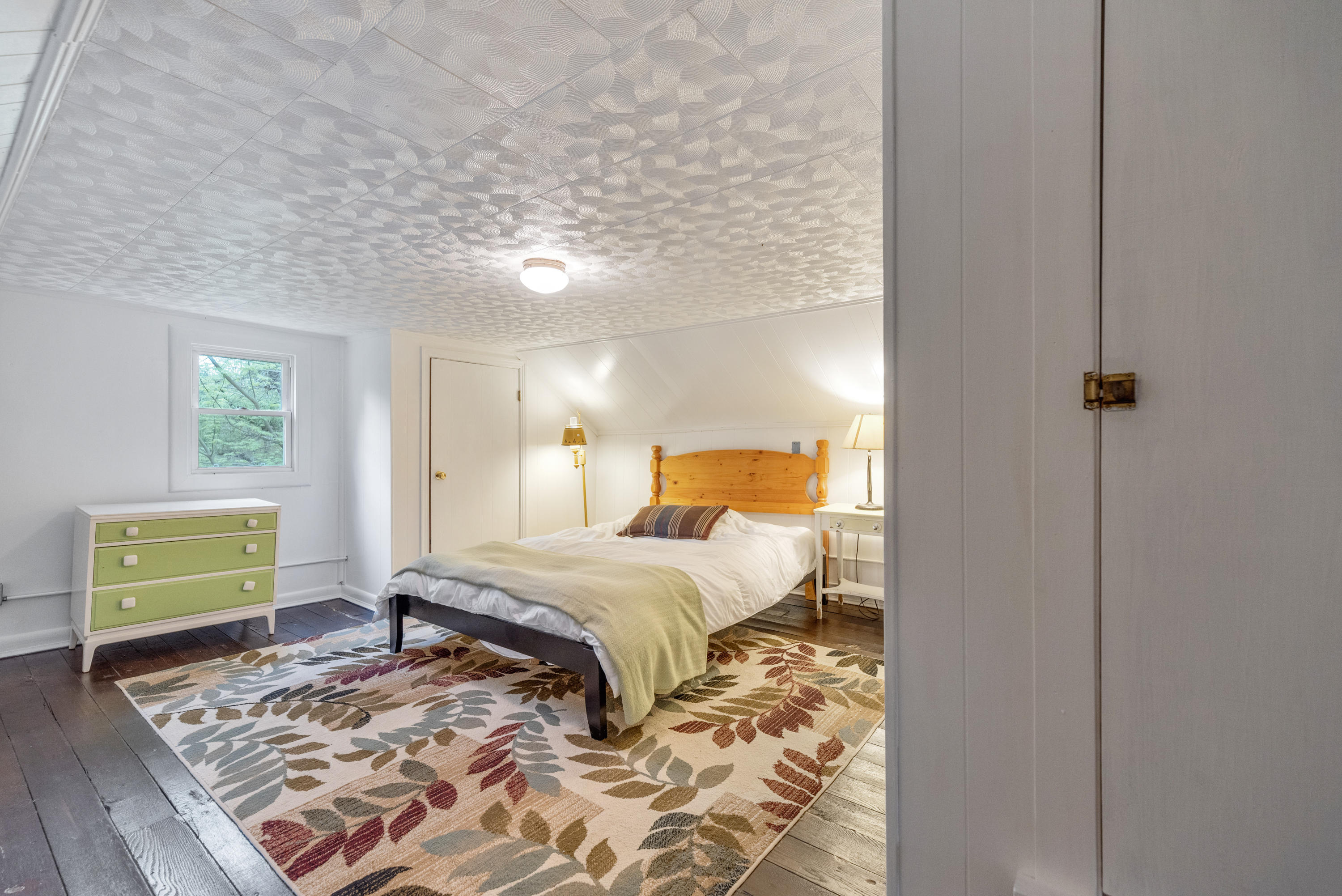 757 Halls Store Road Southwest Willis, VA 24380 - Photo 22 of 43 a bedroom with a bed and a window