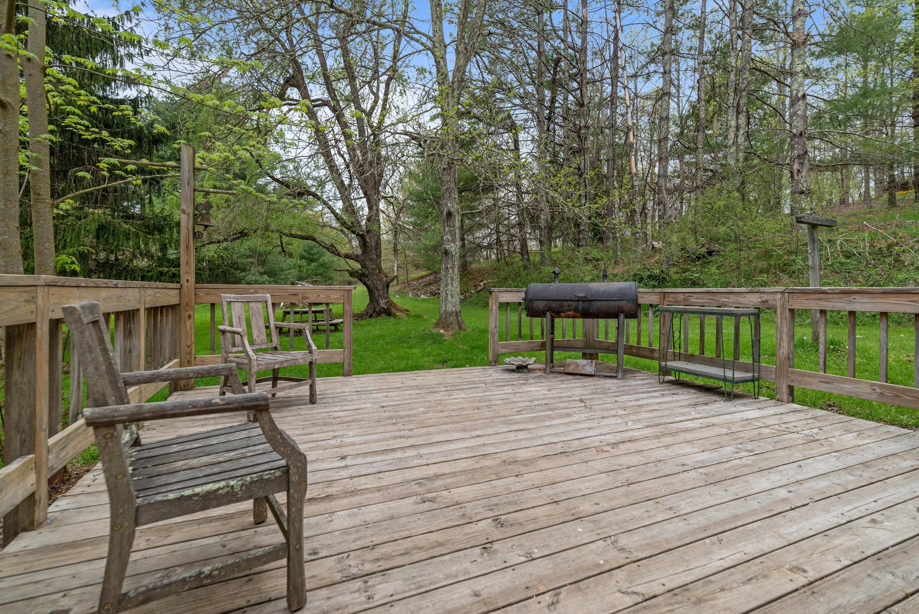 757 Halls Store Road Southwest Willis, VA 24380 - Photo 26 of 43 a view of a deck with furniture and a yard