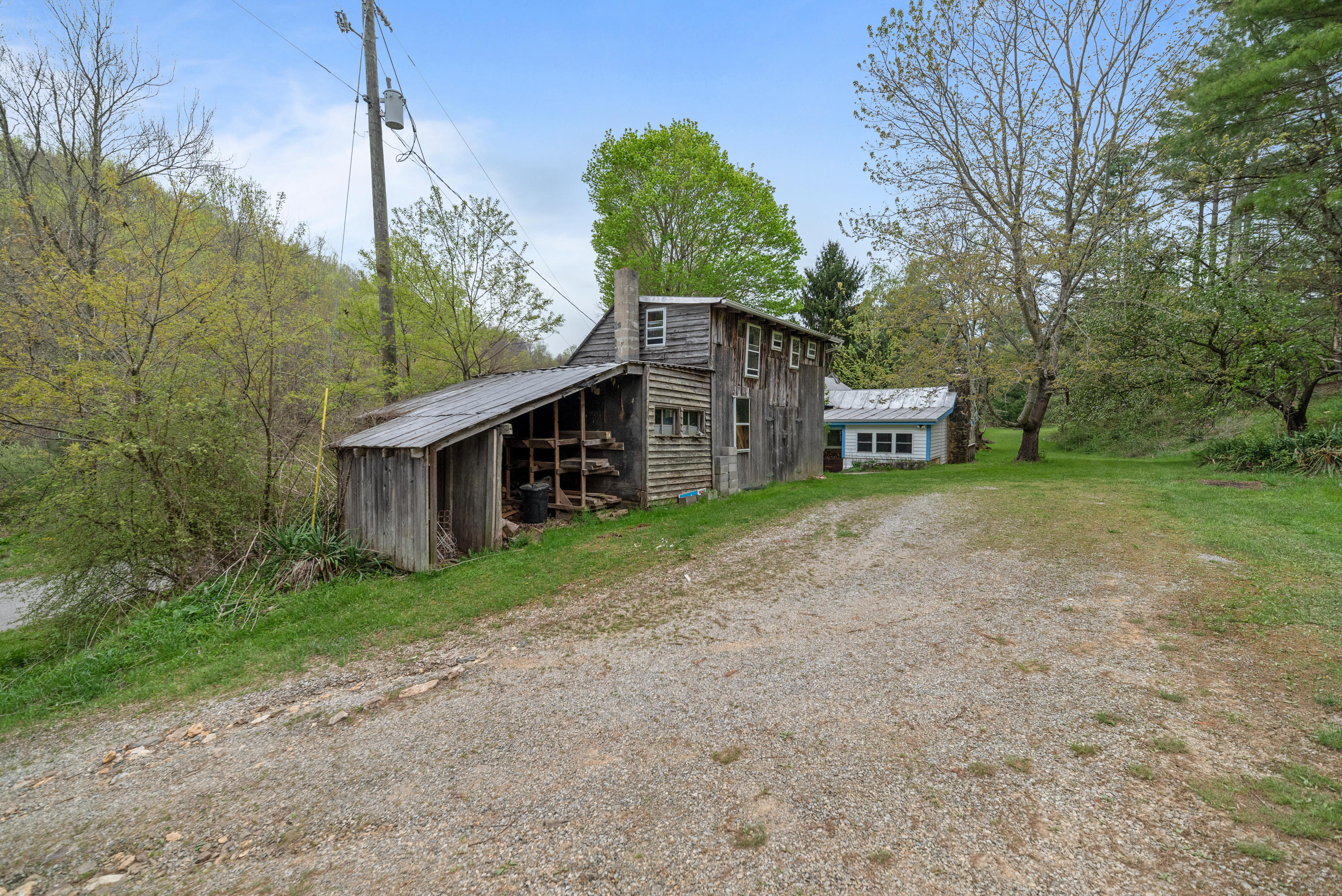 757 Halls Store Road Southwest Willis, VA 24380 - Photo 41 of 43 a view of a house with backyard and trees