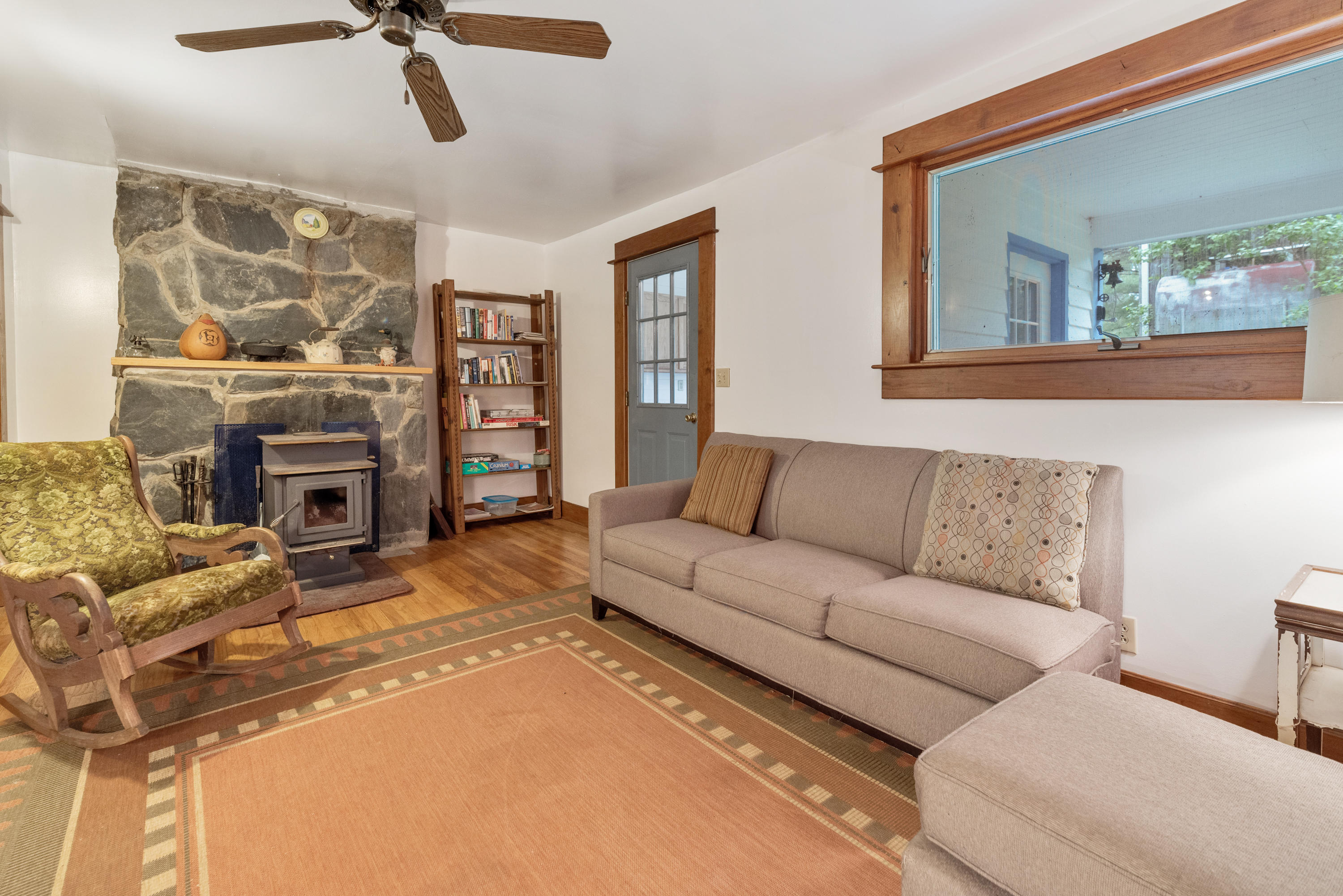 757 Halls Store Road Southwest Willis, VA 24380 - Photo 8 of 43 a living room with furniture and a fireplace